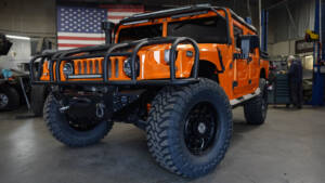 Arancio Atlas Lamborghini 2001 Hummer H1 with brush guard, winch system, and light bars