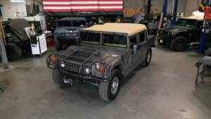 hummer h1 4d soft top with brush guard, winch system, and snorkel driver side angled top view